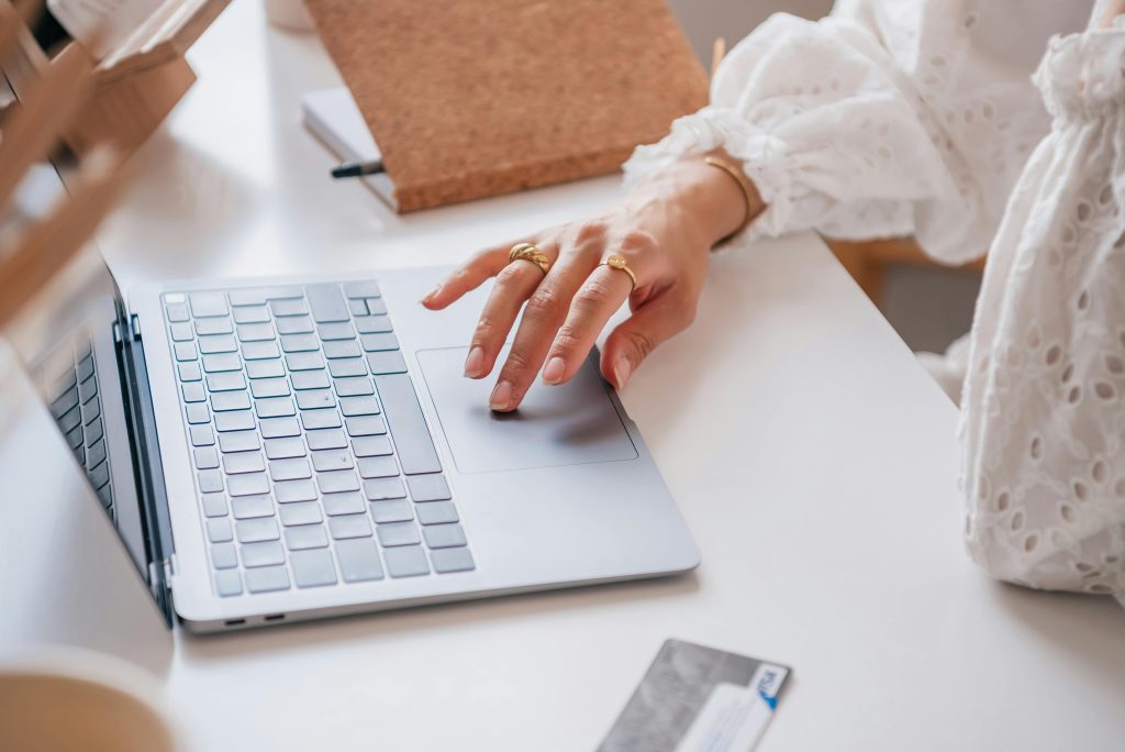Close Up Shot of a Person Using a Laptop